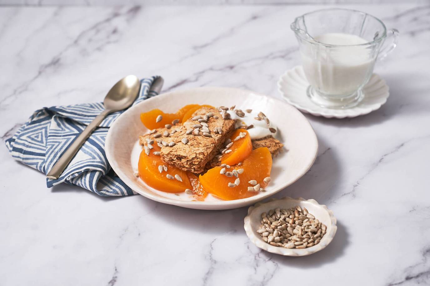 Weet-Bix™ with peaches, sunflower seeds and yoghurt