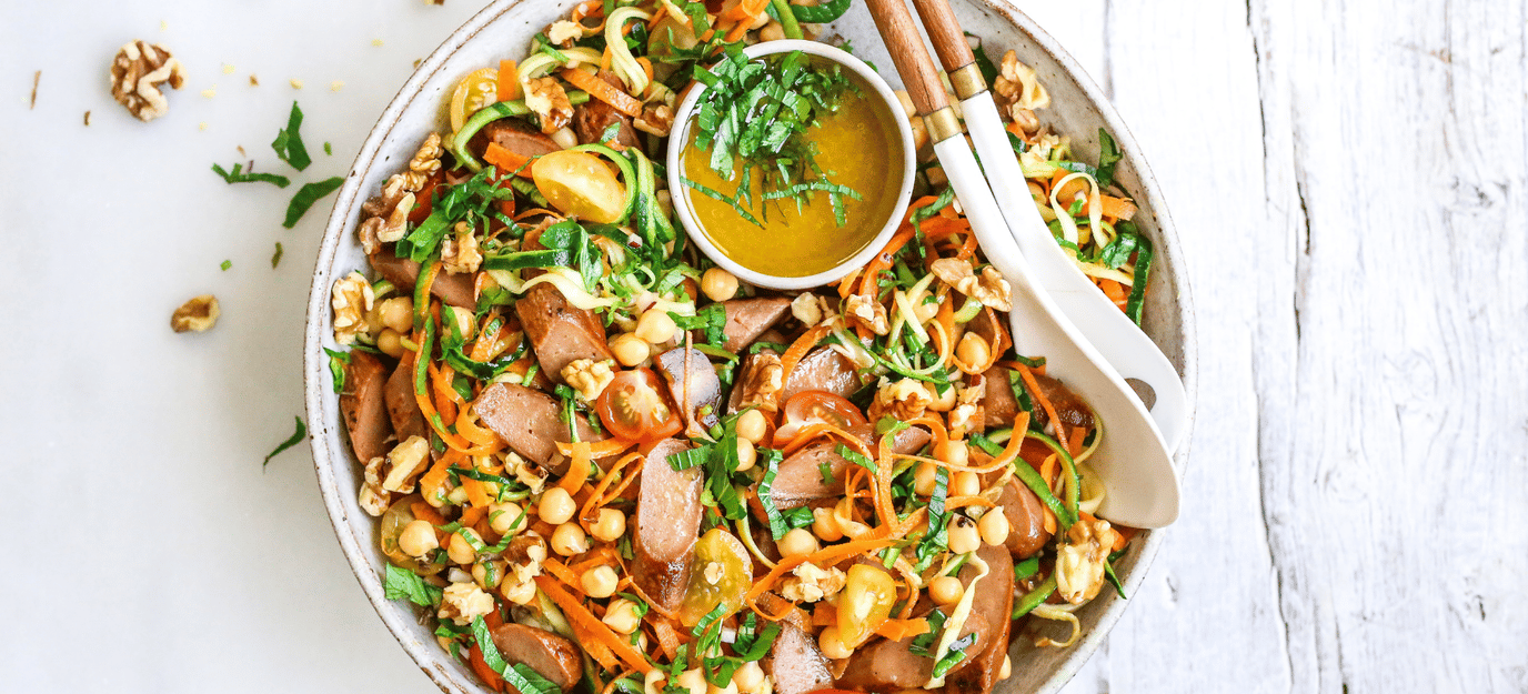 Sunny rainbow salad with vegie sausages