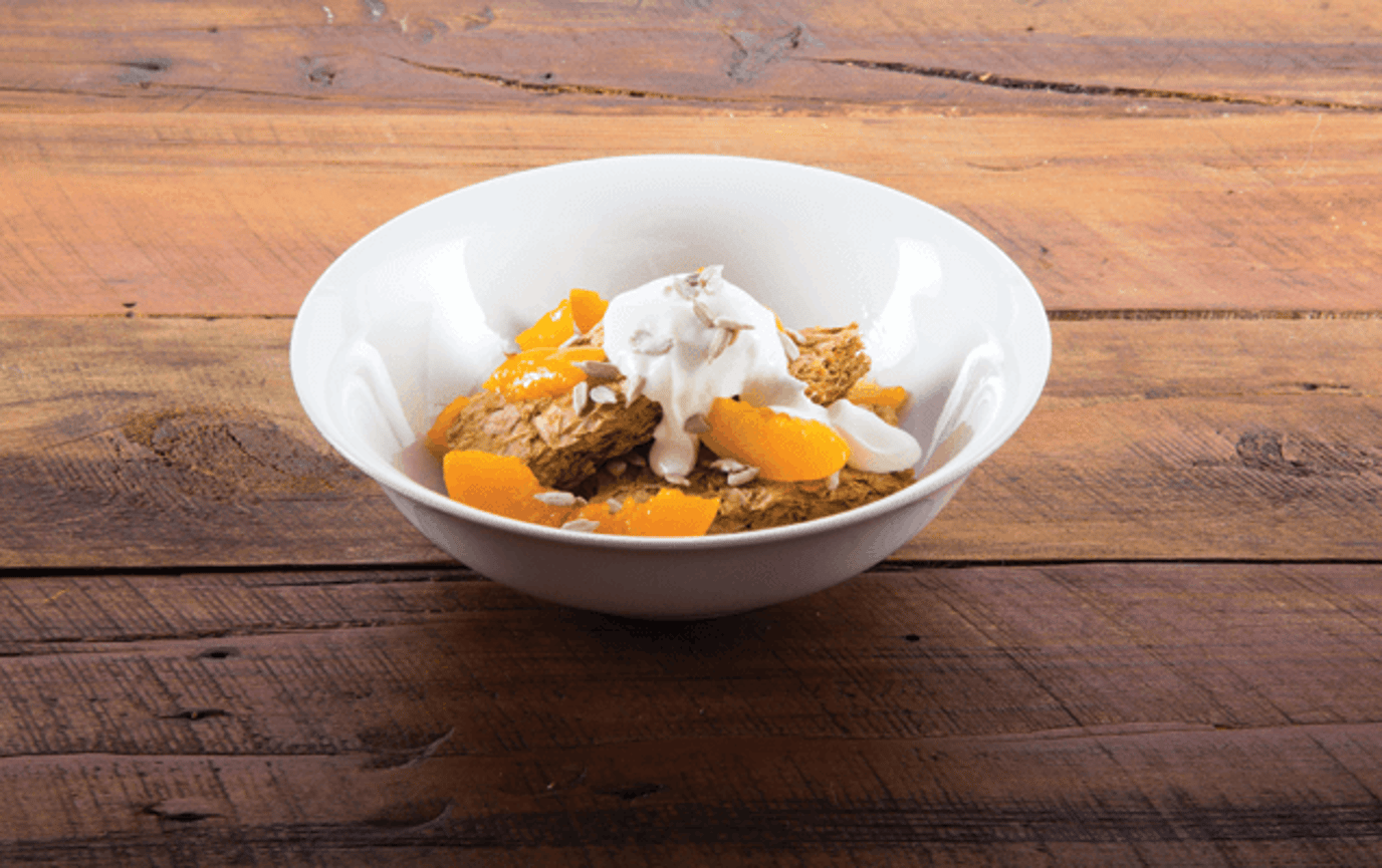 Weet-Bix™ with peaches, sunflower seeds and yoghurt