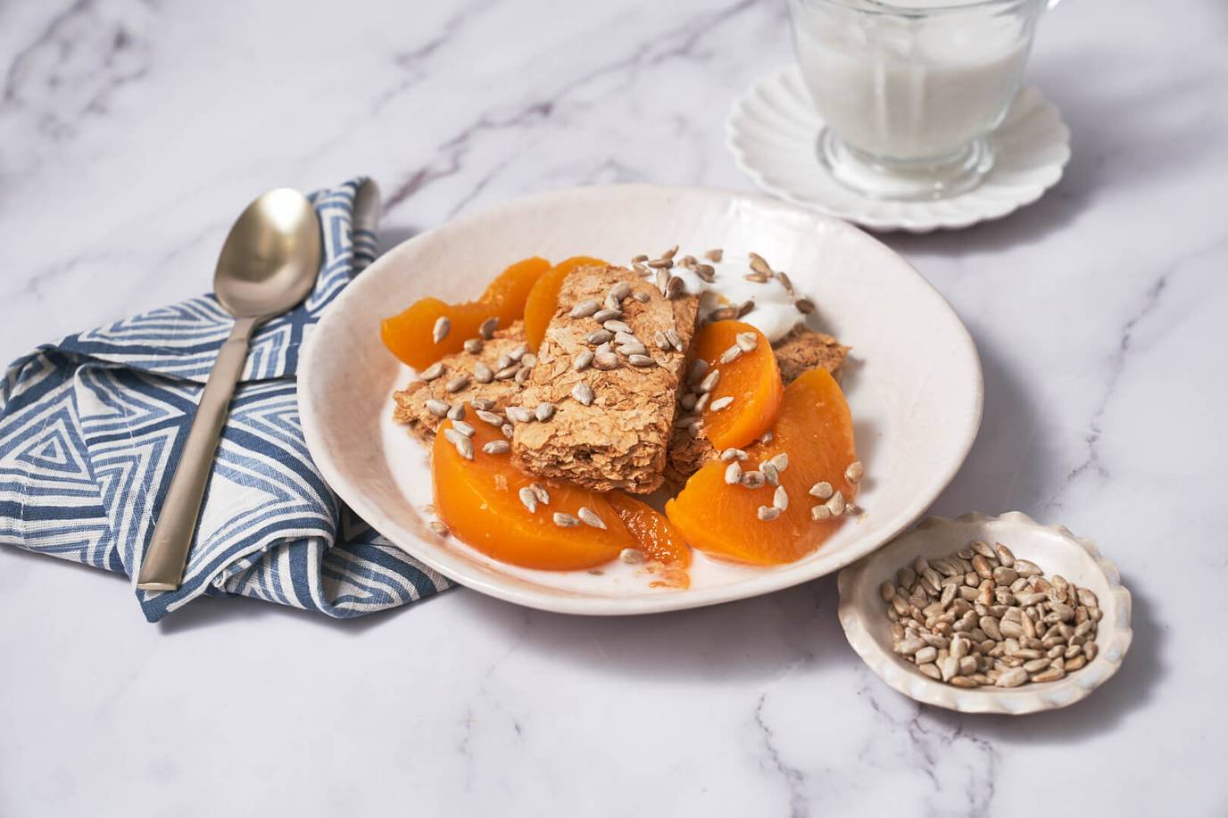 Weet-Bix™ with peaches, sunflower seeds and yoghurt