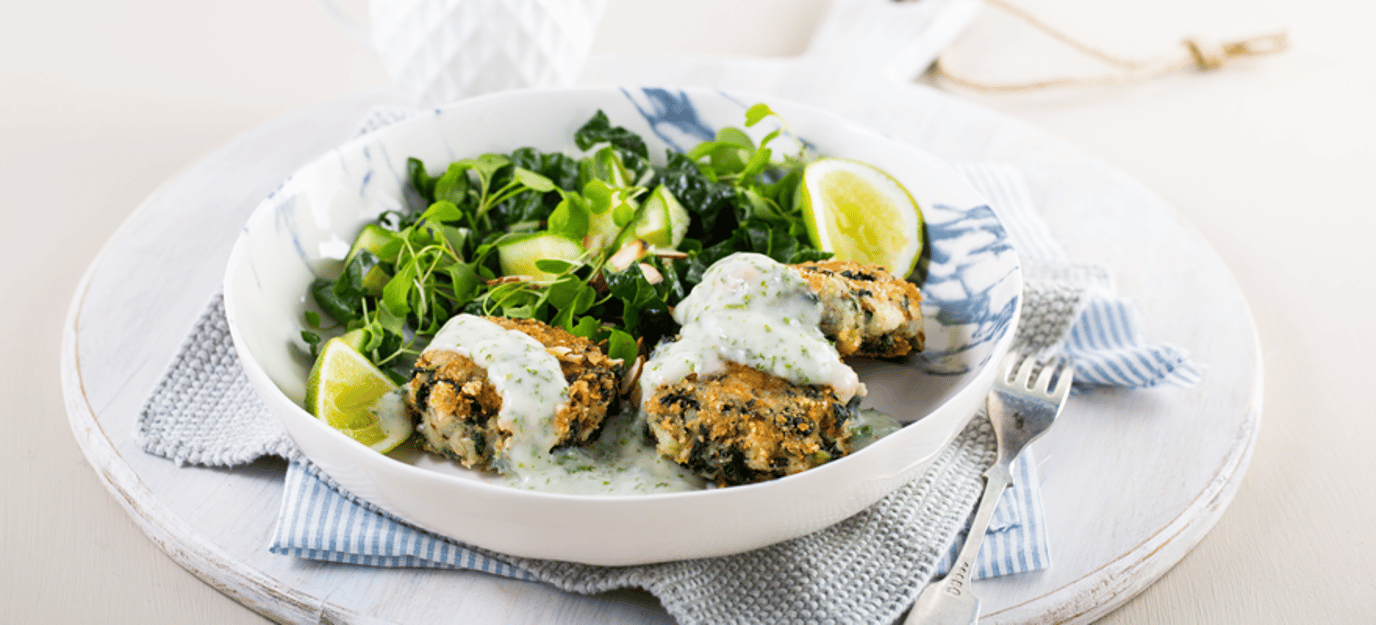Potato and spinach cakes with almond parsley sauce