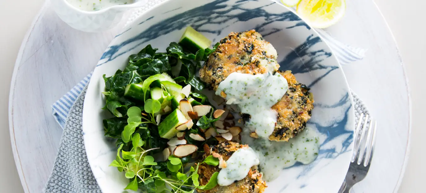 Potato and spinach cakes with almond parsley sauce