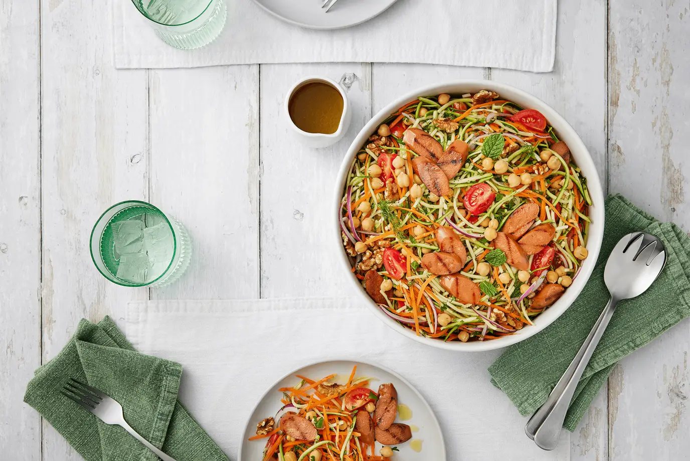 Sunny rainbow salad with vegie sausages Sunny rainbow salad with vegie sausages