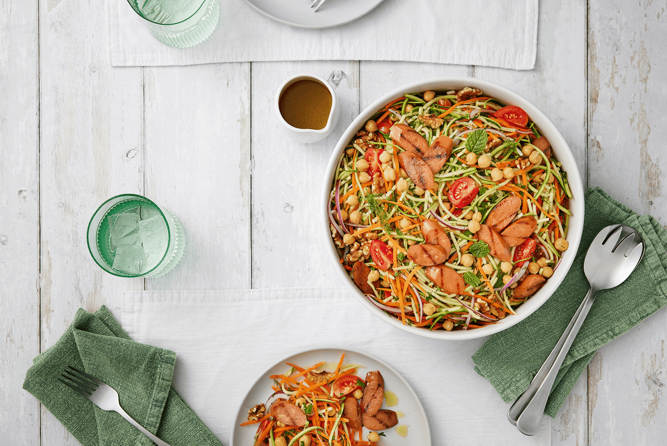 Sunny rainbow salad with vegie sausages