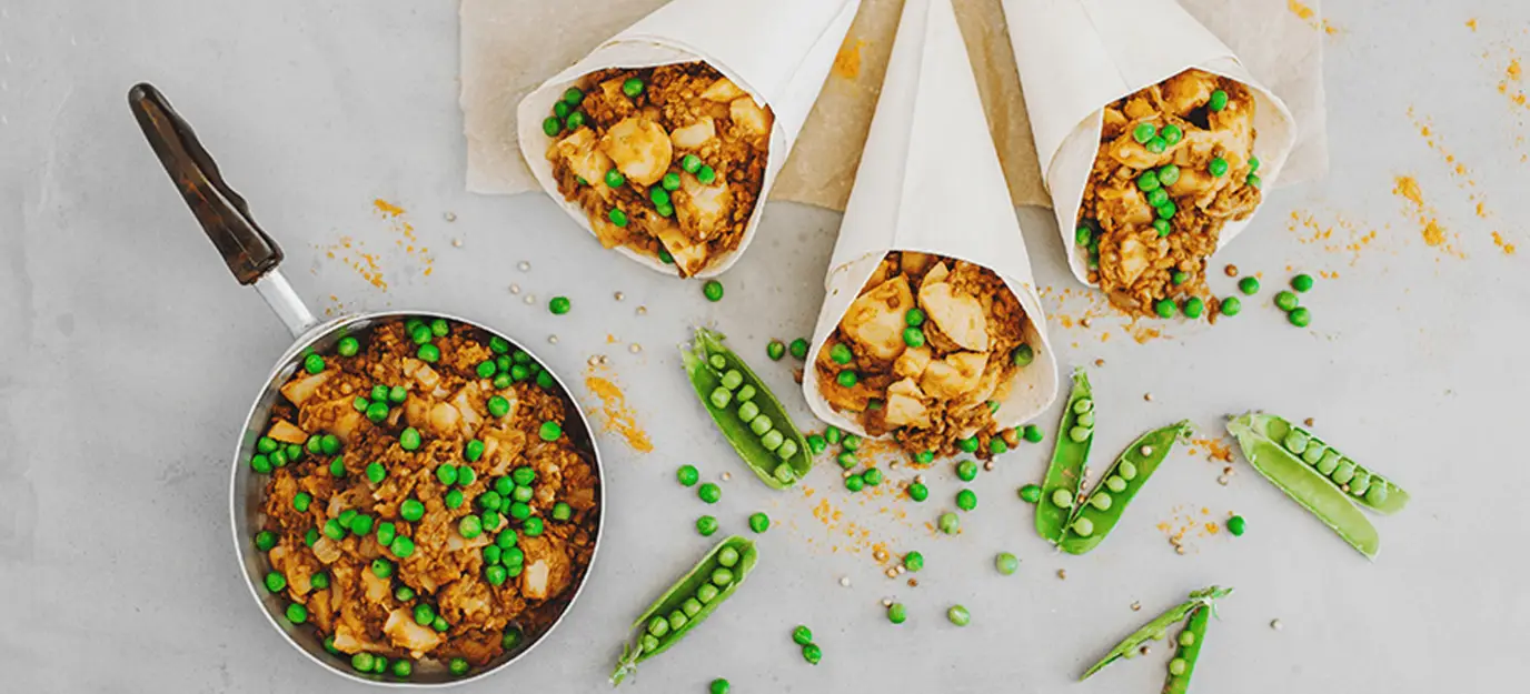 Potato and pea curry in roti cones