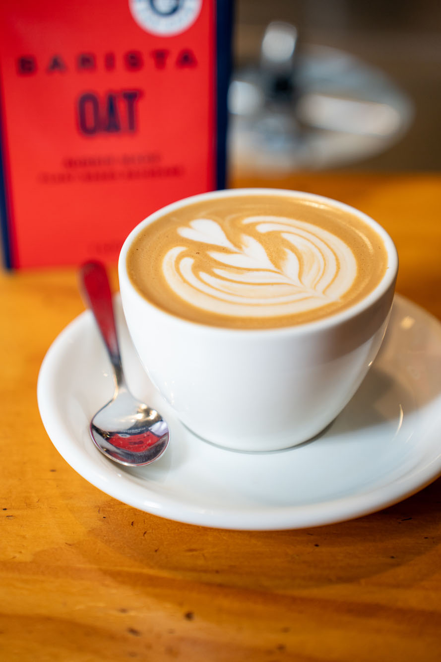 Image for a coffee-related blog post featuring a branded/packaged coffee product and its label. Useful as supporting photography for an article about coffee, café culture, or a specific coffee brand/product.
