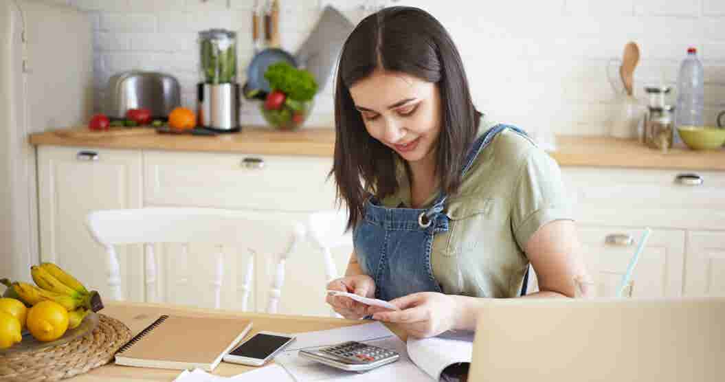 Woman during her taxes at home.