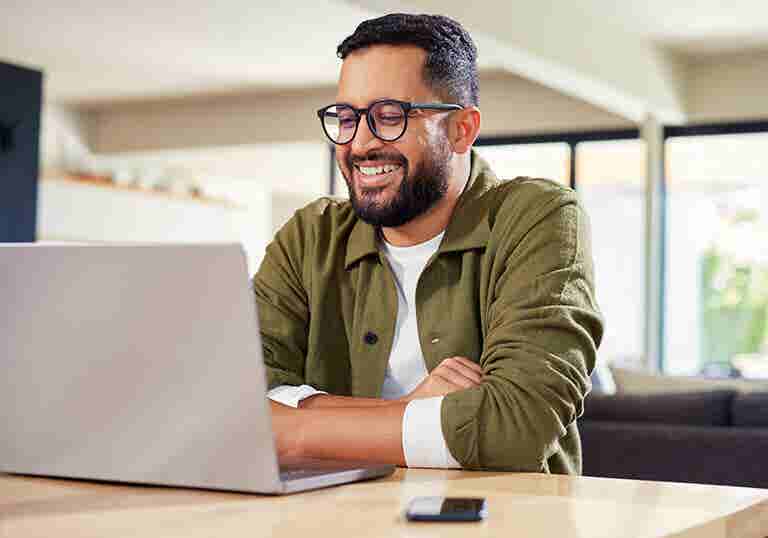 Man researching hard money loans on his laptop