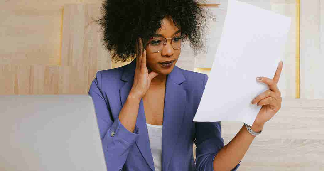 Woman reading about the impact medical debt has on her credit score.