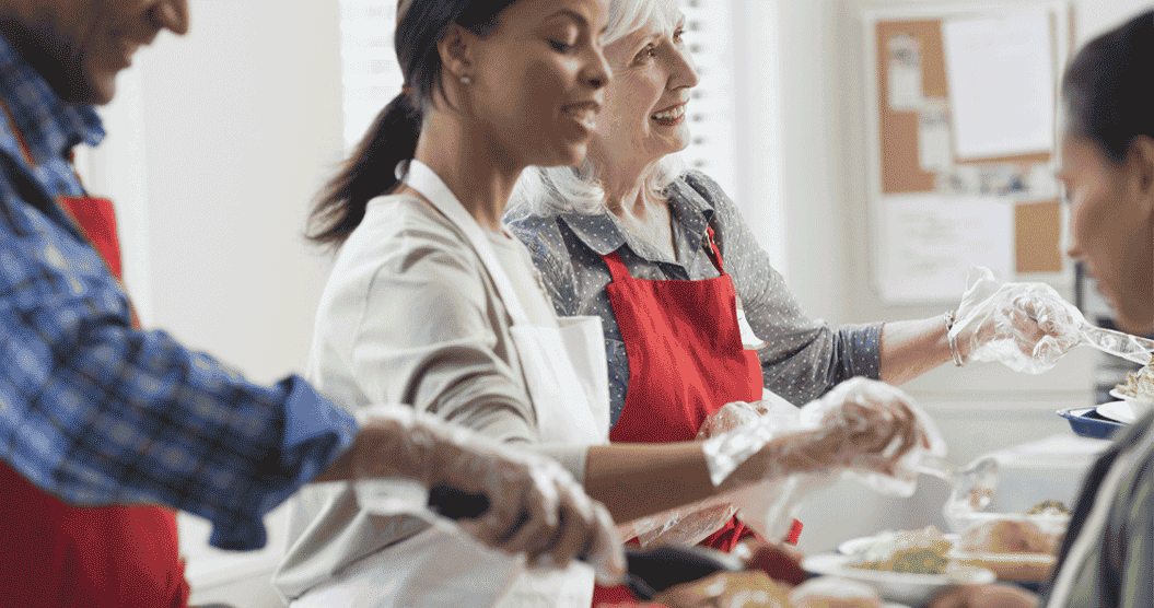 Volunteers serving food to the community