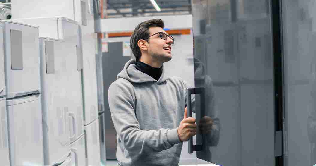 Man shopping for appliances using his tax refund