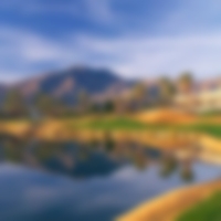 Water guarding the fairway to the left with mountains acting at the backdrop at La Quinta.