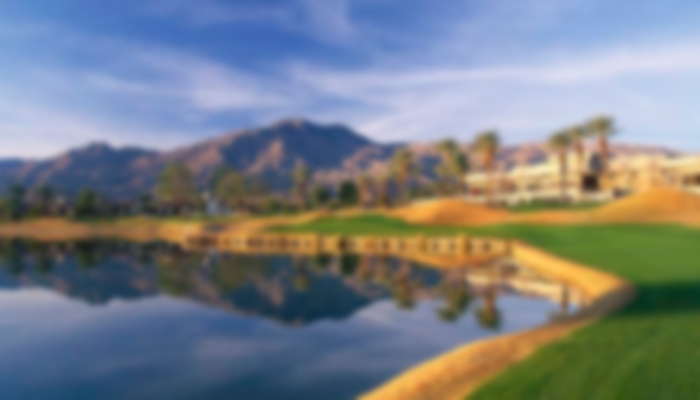 Water guarding the fairway to the left with mountains acting at the backdrop at La Quinta.