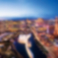 Aerial view of the skyline and city centre with all the lights on.