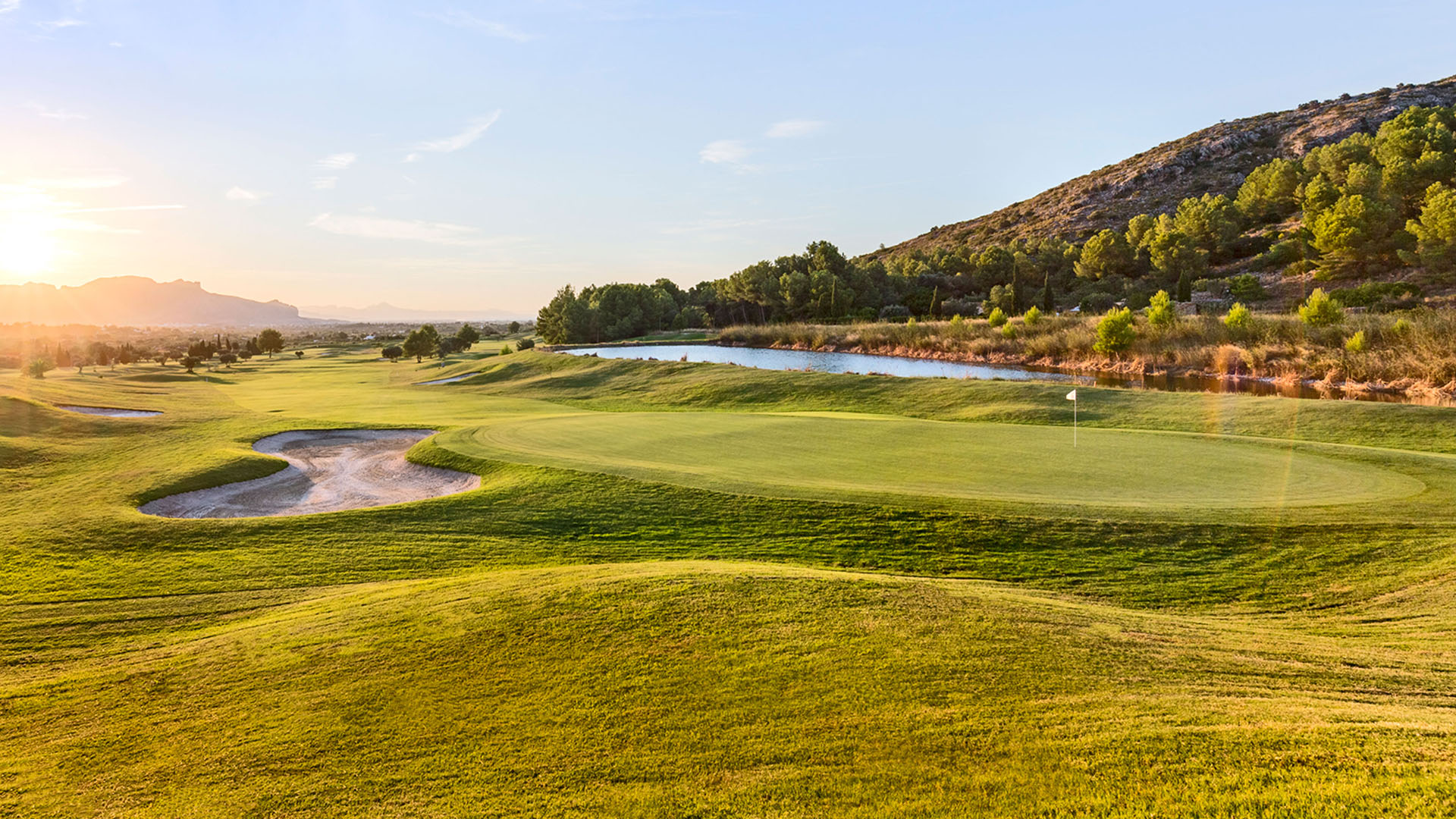 Sunrise in beautiful Benidorm with wide greens and mountainous surroundings