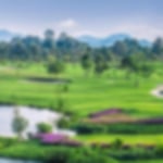 The green and fairway at Siam Plantation with water left and trees lining the hoizon.