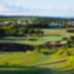 Upward view of a par 3 at Westmoreland, overlooking the distant houses and horizon.