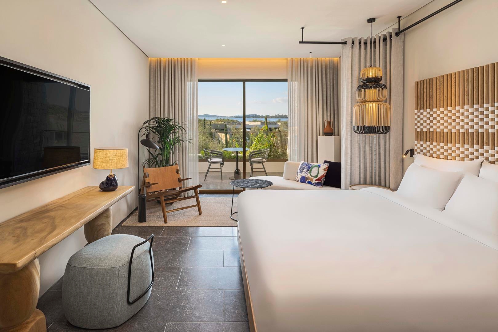 Bay view room at W Costa Navarino with double bed and large windows