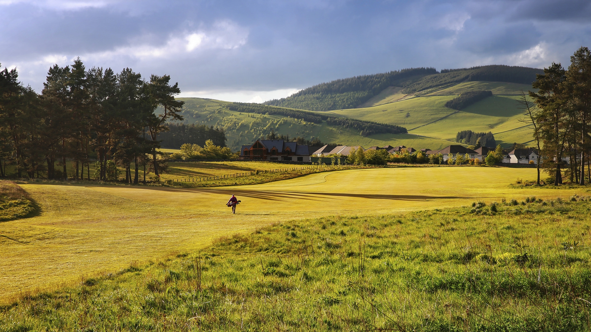 Valley view in the background of stunning golf course.