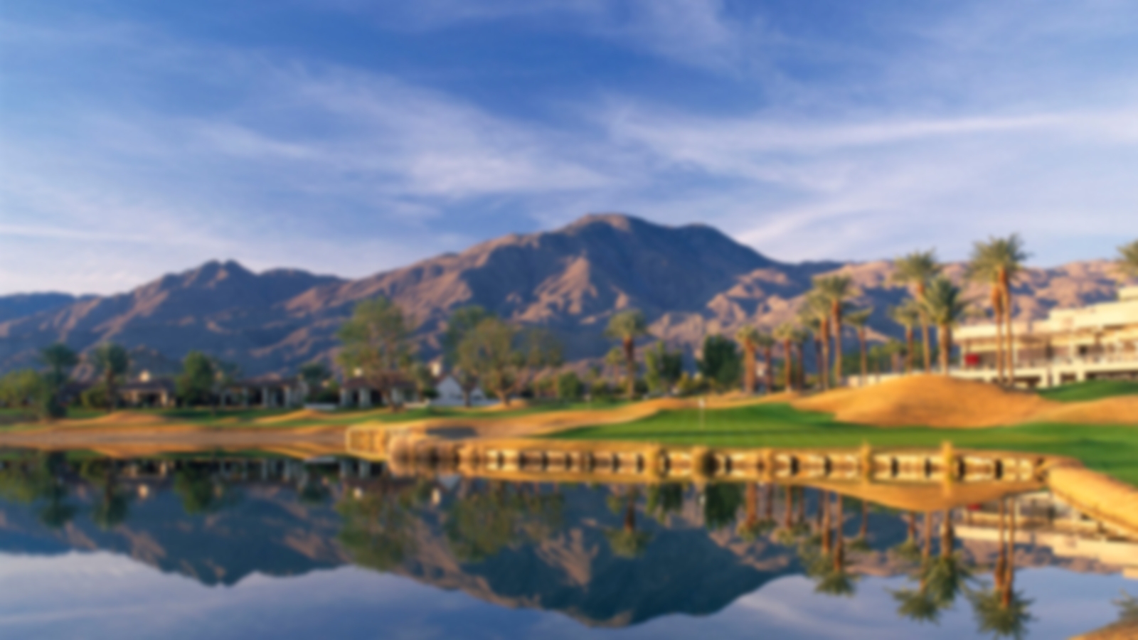 Water guarding the fairway to the left with mountains acting at the backdrop at La Quinta.