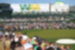 Spectators surround the green and get close to the action at the WM Phoenix Open