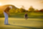 Golfers on the green AdobeStock