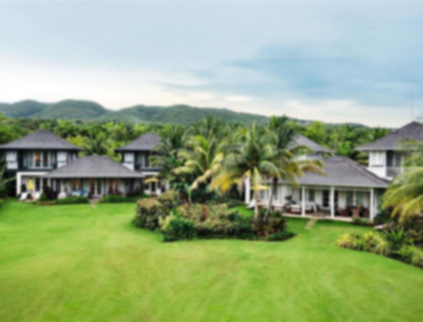 Three villas leading onto grassed garden area