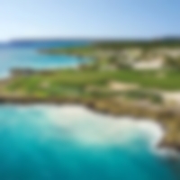 Fairway and hole that run next to the stunning clear blue sea at Punta Espada.