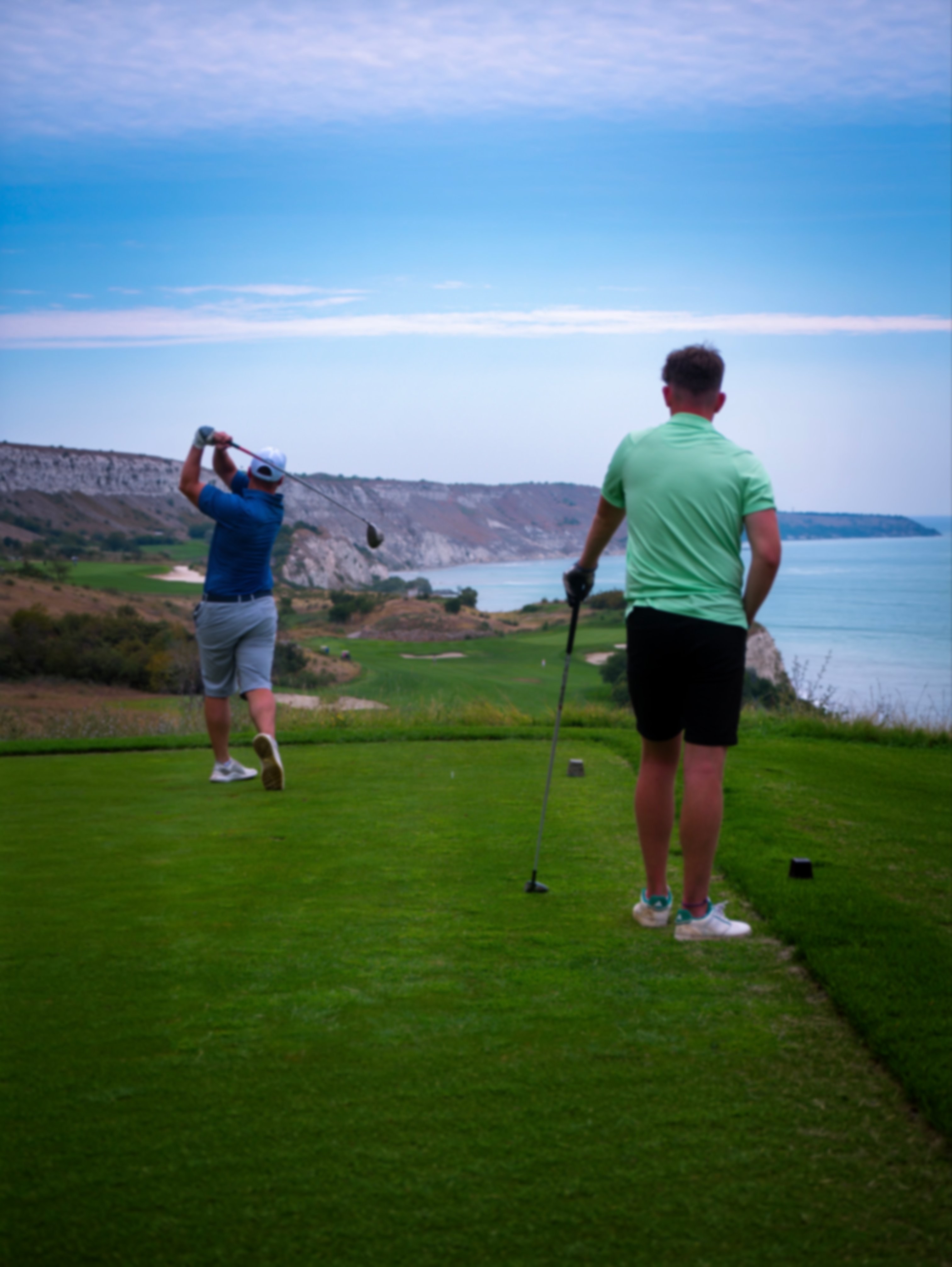 Golfers teeing off at Thracian cliffs golf course
