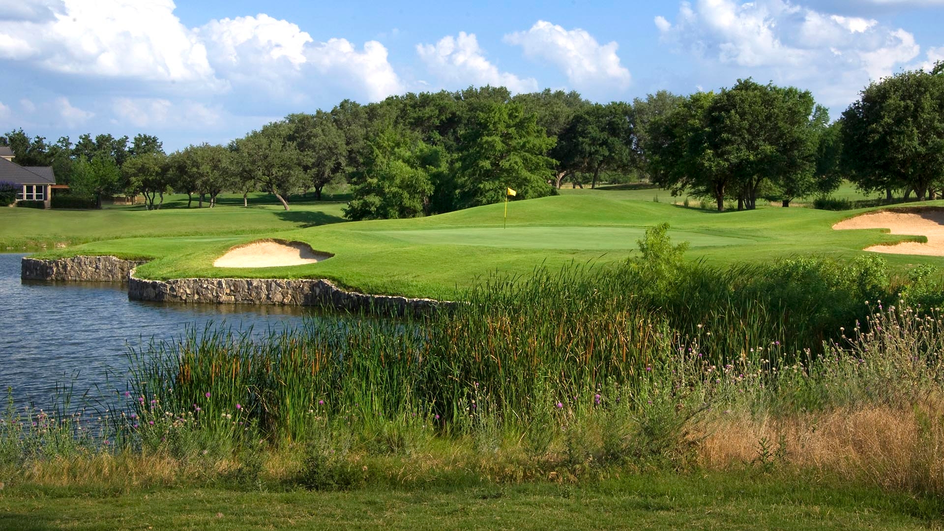 The green approach shot over water with bunkers guarding the green either side.