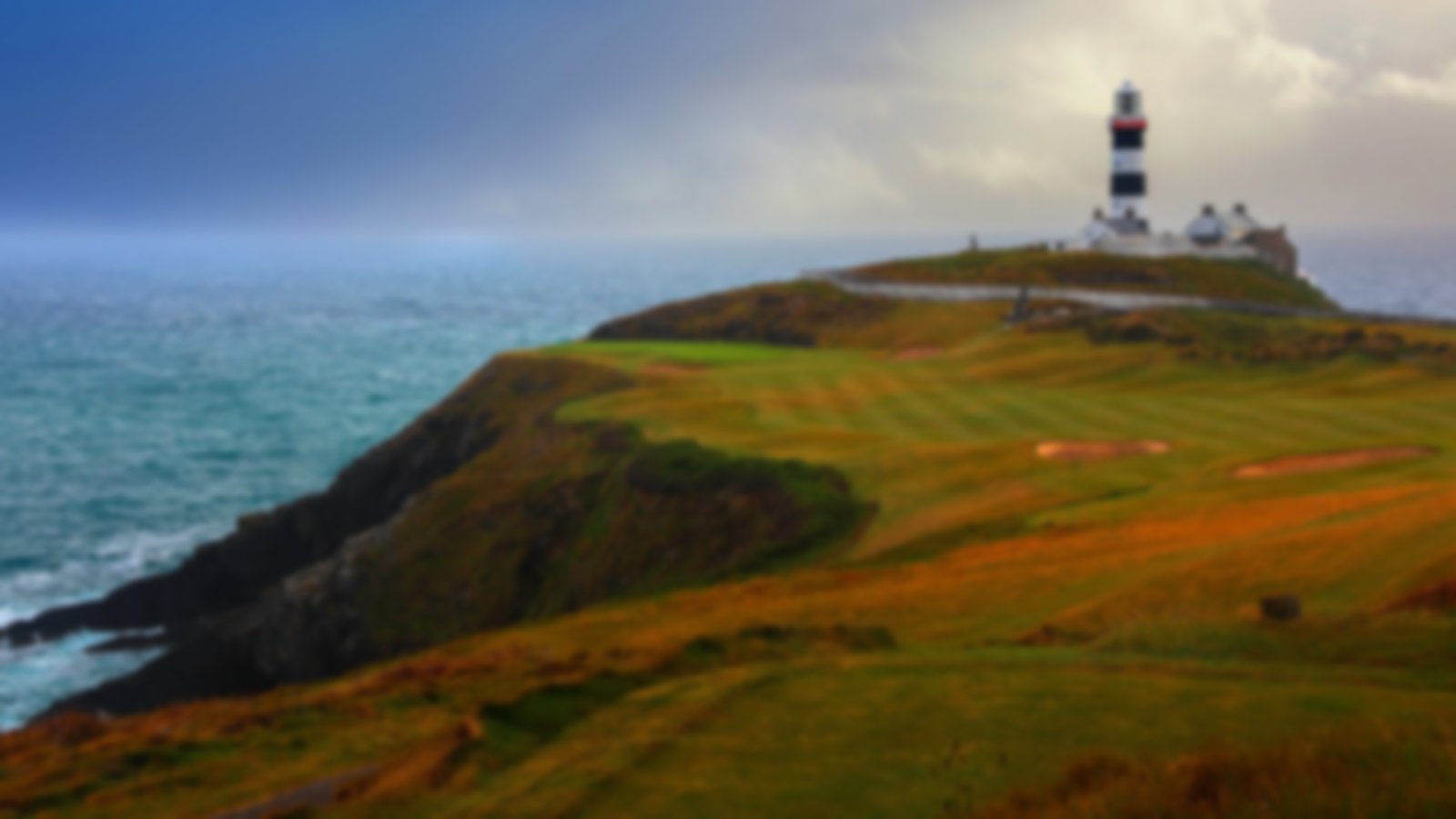 Spectacular ocean side hole at Old Head Links with the lighthouse in the backdrop.