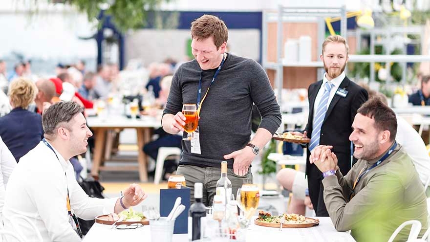 Customers enjoying food and drinks in tournament hospitality