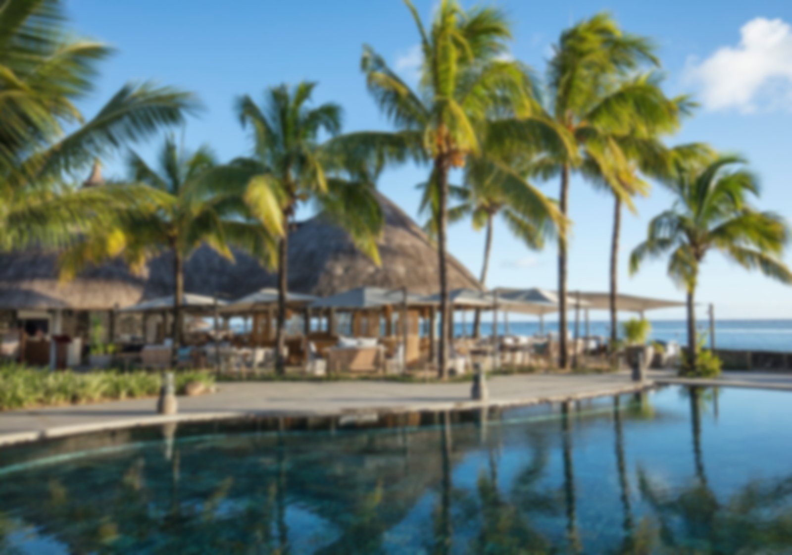 Pool grounds at Heritage Awali with sea view