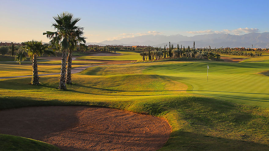 Bunkers guard the green at Ourikav with the Marrakech mountains acting as the backdrop.