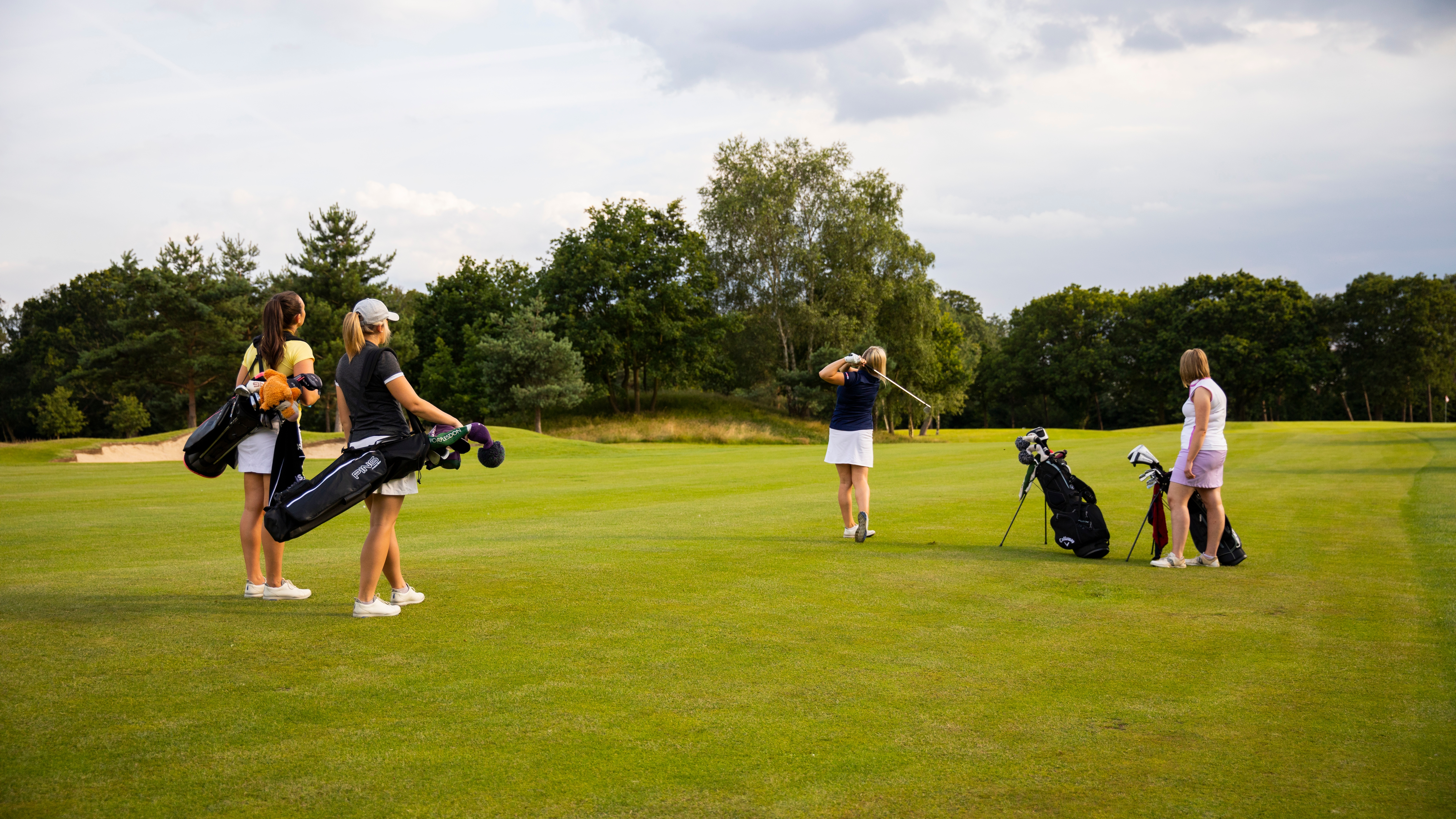 female golfers on course - image 1