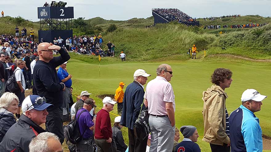 Spectators watching the approaching shots to the green at The Open