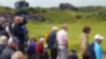 Spectators watching the approaching shots to the green at The Open