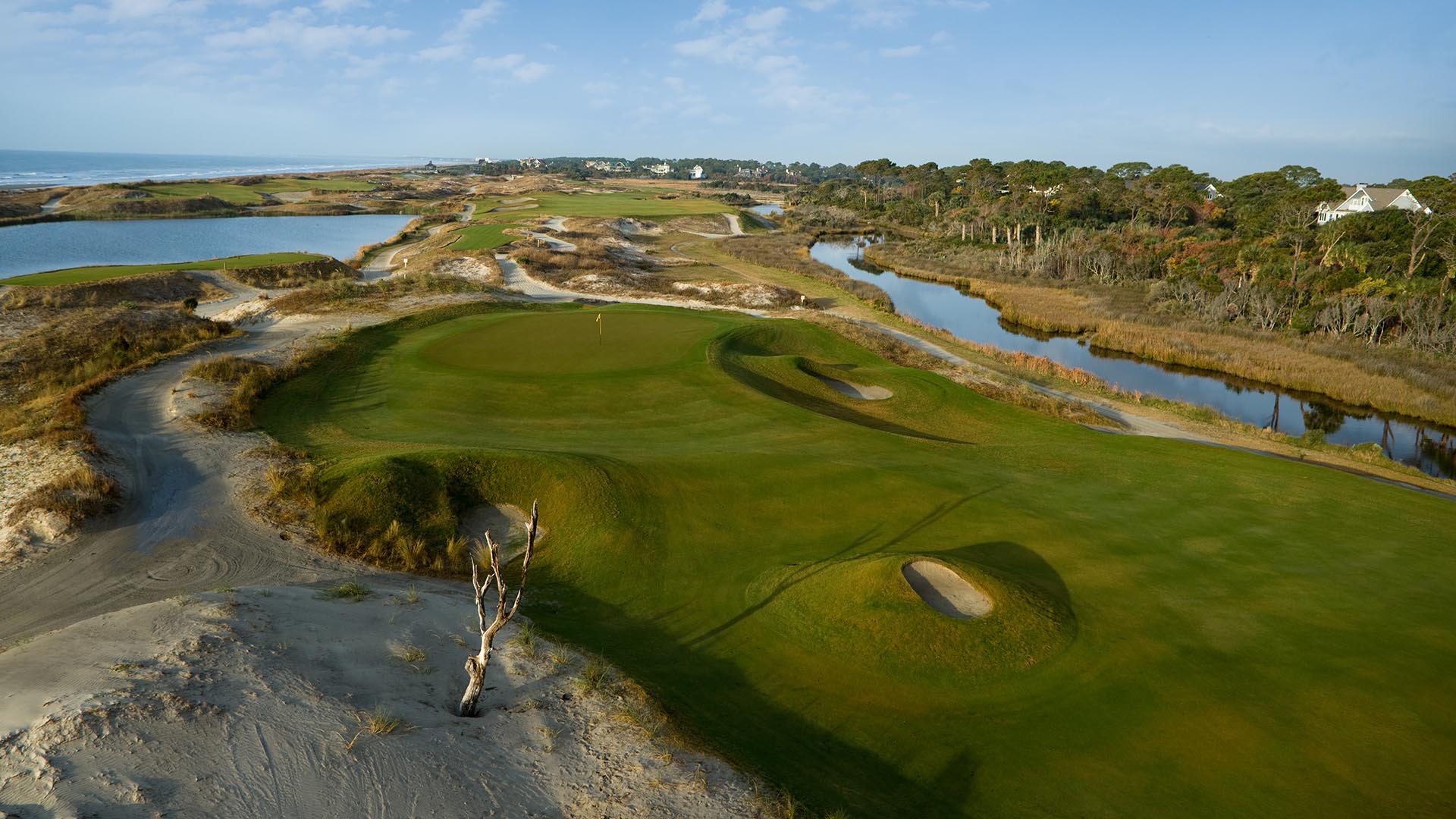 Aerial view of the fairway and green at Kiawah Island. Water hazards are guarding both sides of the green.