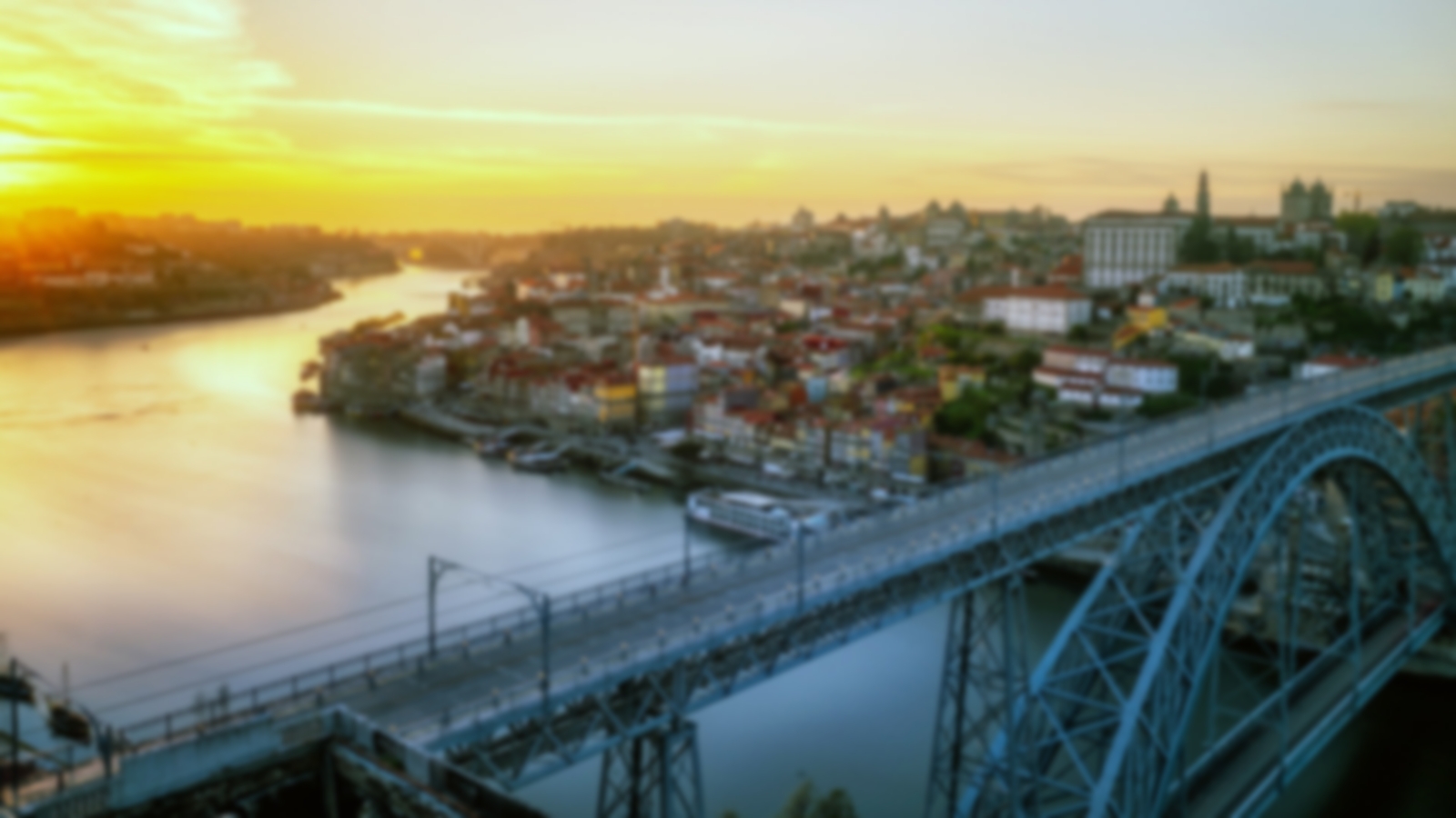 Sunset over Porto with a wide river running going through it