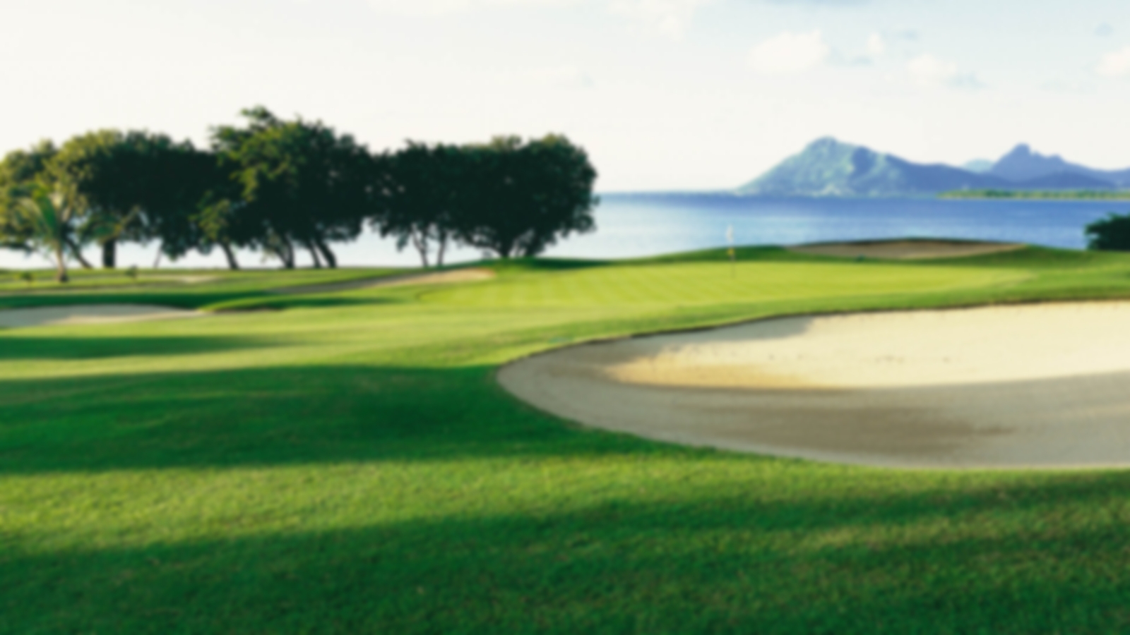 Smooth sand bunkers with sea and mountain views in the surrounding area