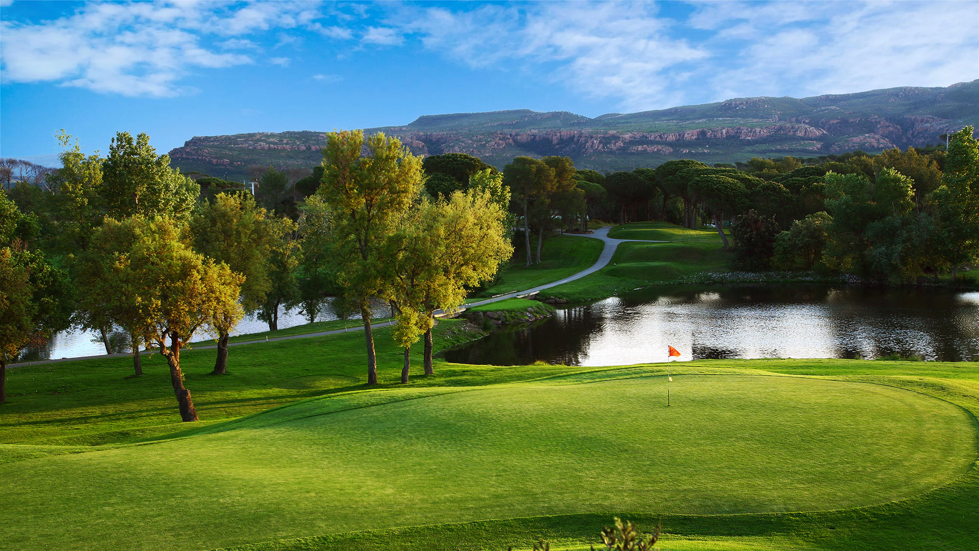 Scenic water fronted green at Golf de Saint Endreol.