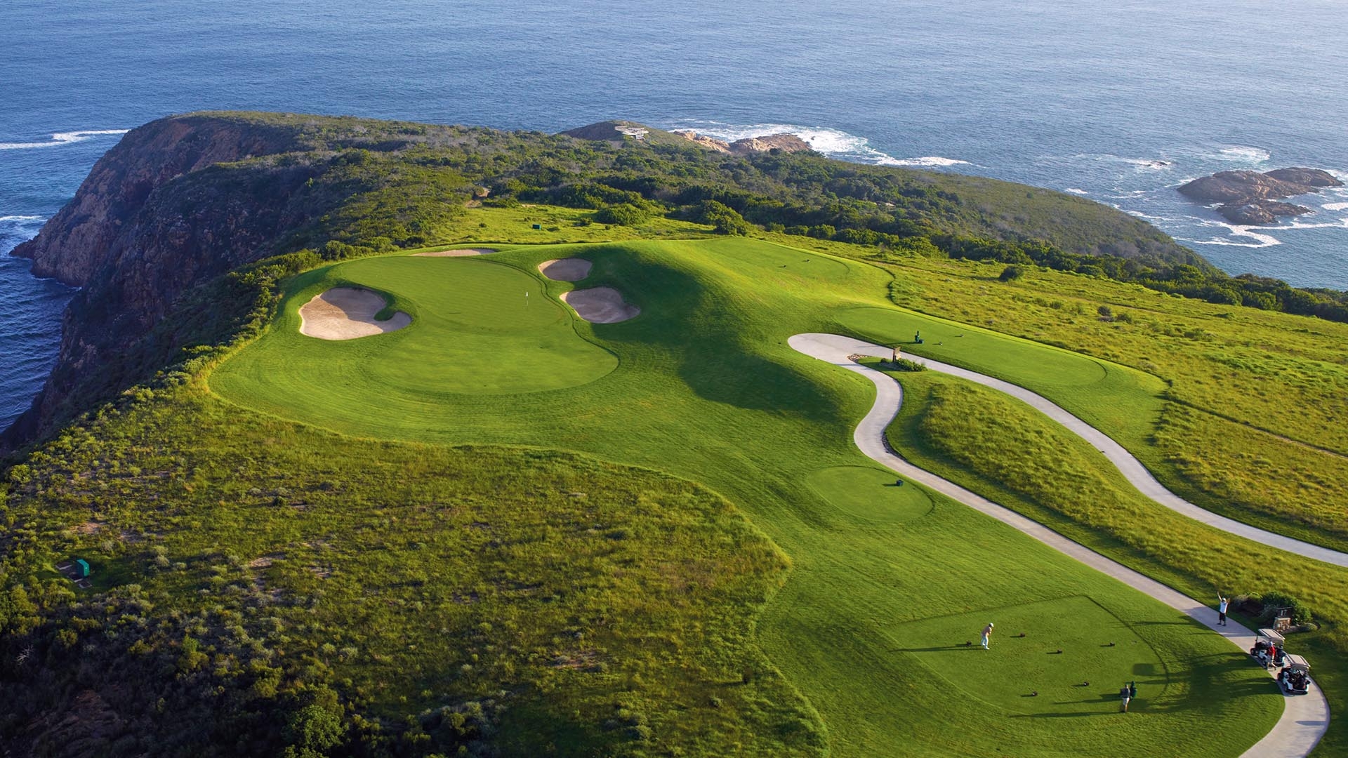 Clifftop hole, aerial view of the green with the cliffs and sea in the background.