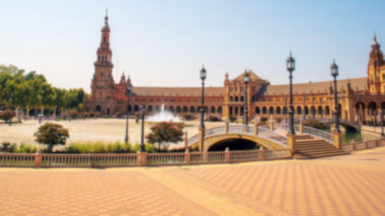 The centre of Sevilla with bridge to a courtyard of nice buildings and water fountains