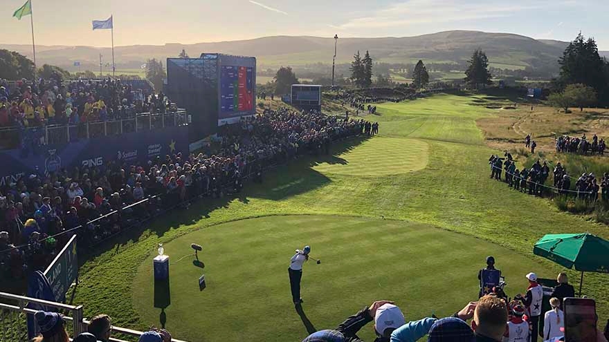 Player tees off in front of the grandstands during the 2014 Ryder Cup at Gleneagles