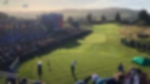 Player tees off in front of the grandstands during the 2014 Ryder Cup at Gleneagles