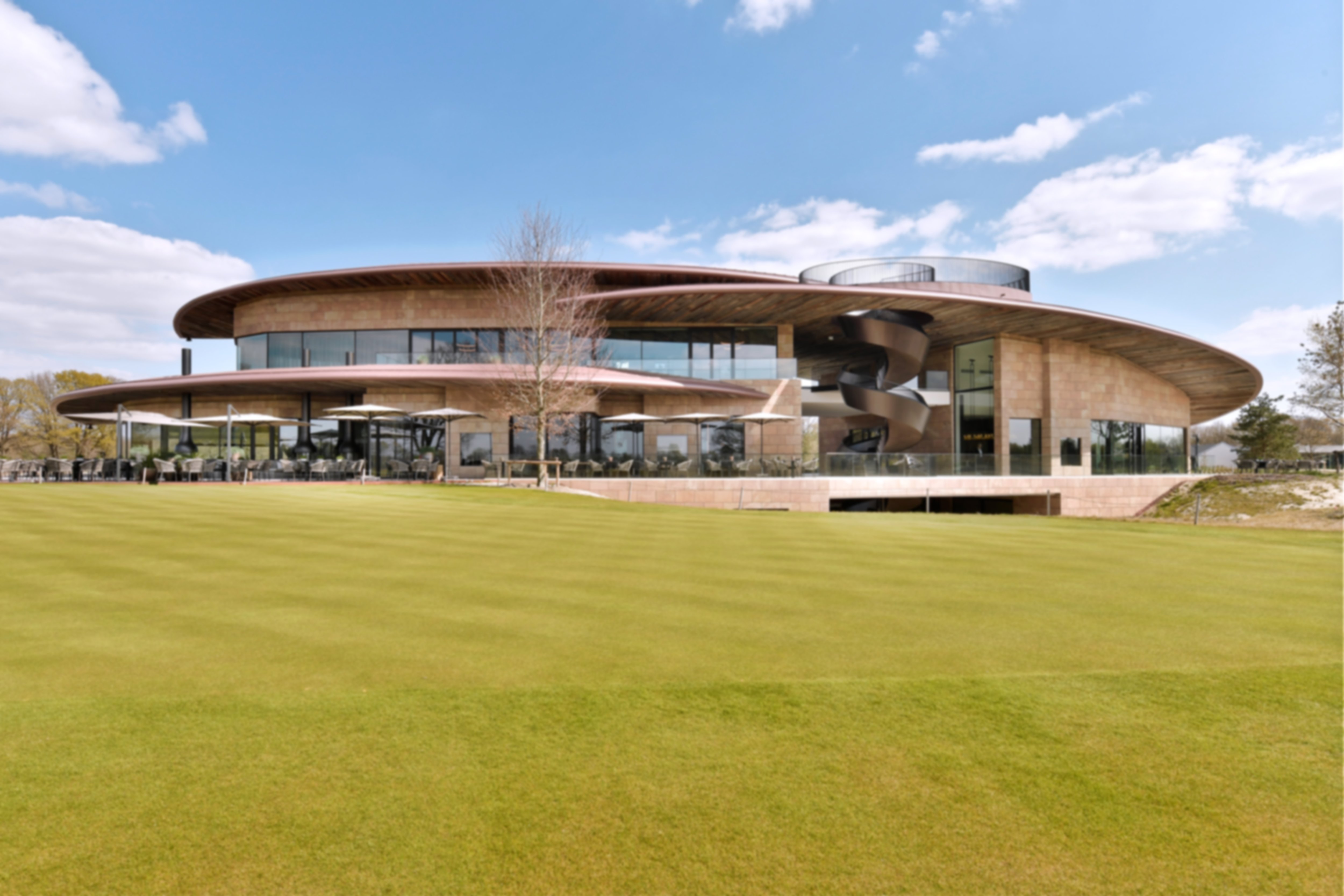The sleek and modern Bernardus Clubhouse with floor-to-ceiling glass, clean architectural lines and warm natural materials