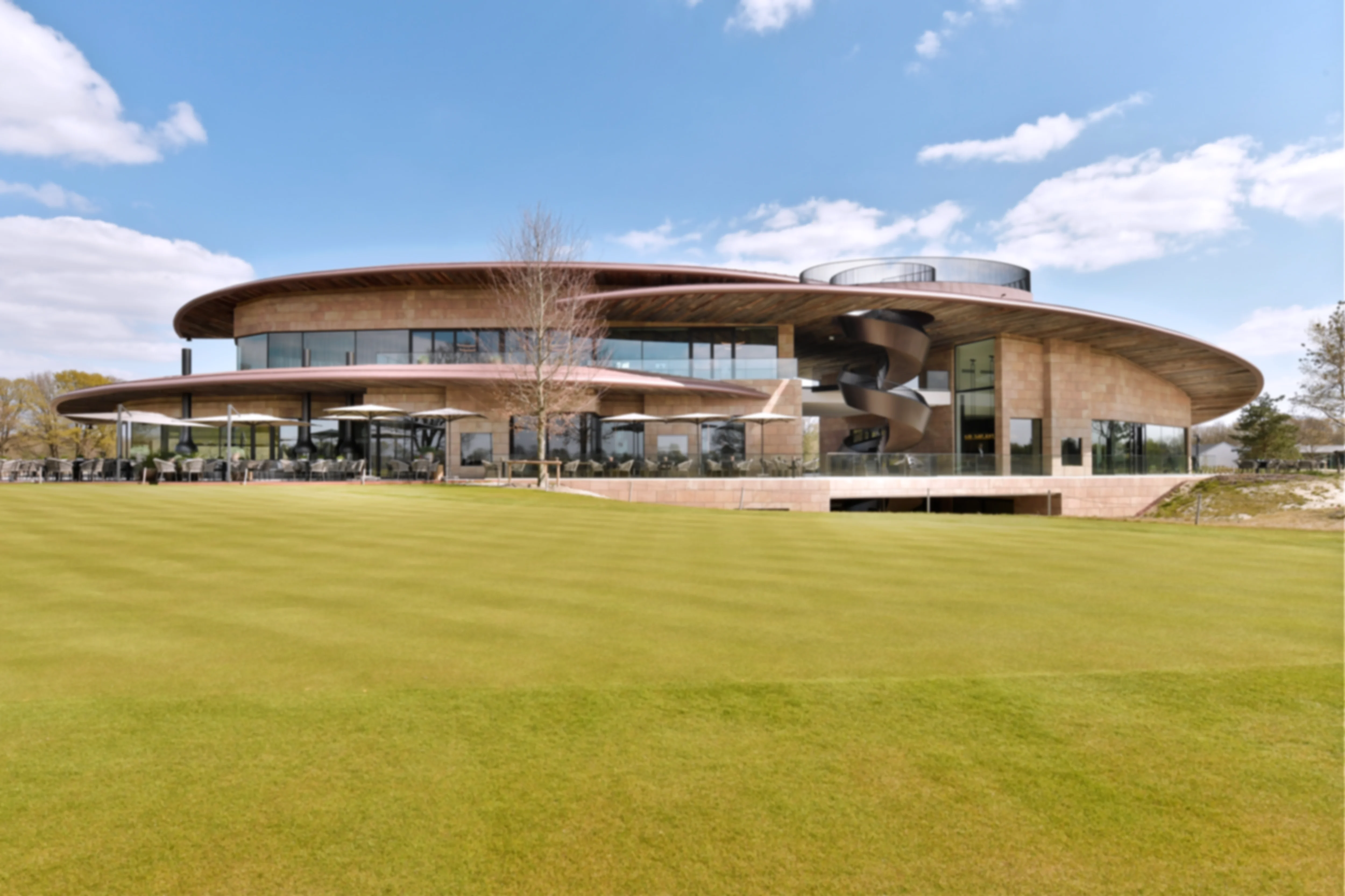 The sleek and modern Bernardus Clubhouse with floor-to-ceiling glass, clean architectural lines and warm natural materials