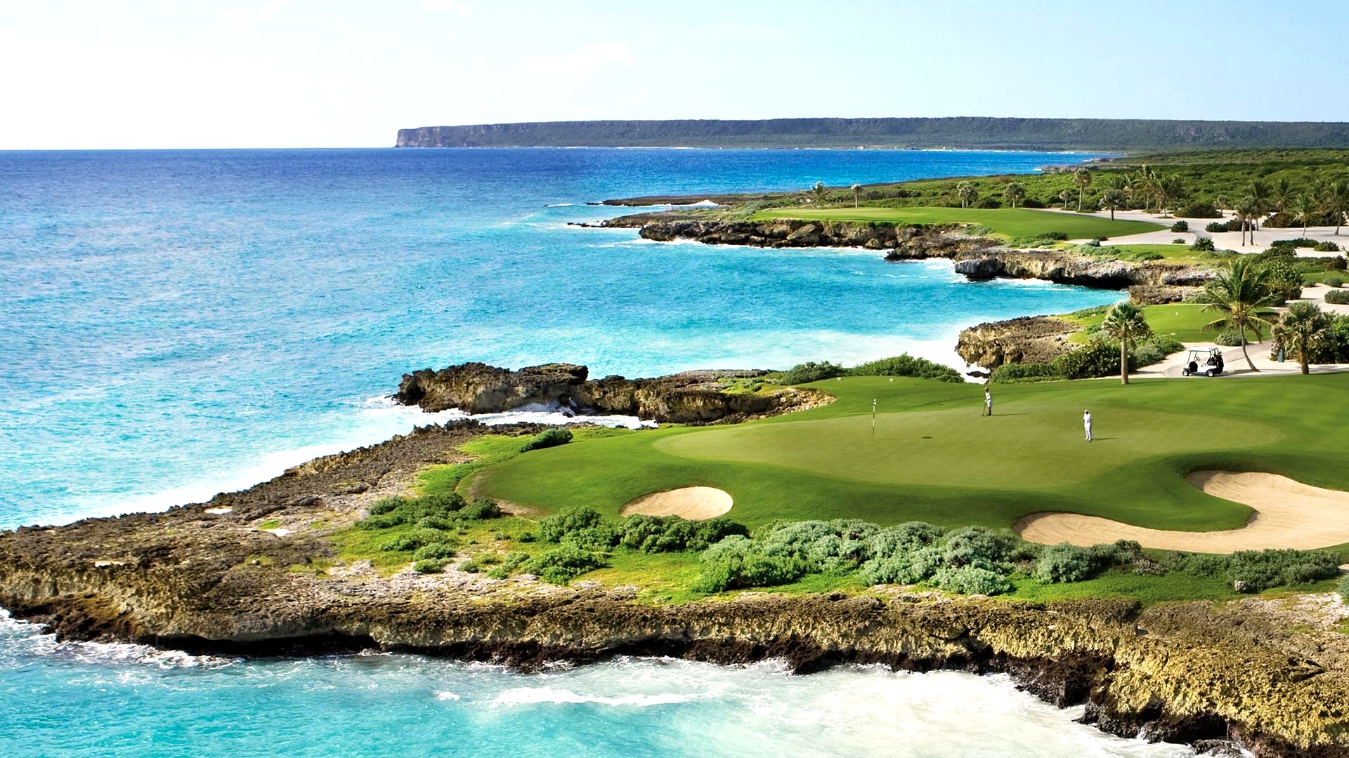 Fairway and hole that run next to the stunning clear blue sea at Punta Espada.