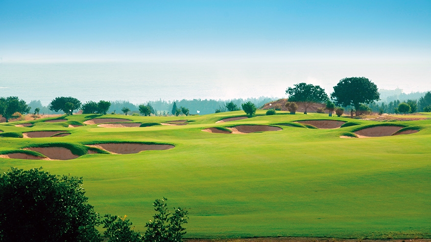 Bunker filled fairway at Elea with blue skies