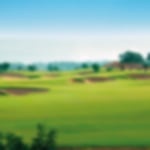 Bunker filled fairway at Elea with blue skies